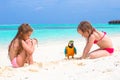 Adorable little girls with big colorful parrot Royalty Free Stock Photo