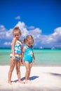 Adorable little girls have fun on white beach Royalty Free Stock Photo