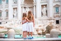 Adorable little girls near the Fountain of Trevi in Rome. Happy kids enjoy their european vacation in Italy Royalty Free Stock Photo