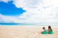 Adorable little girls during summer vacation. Kids with beach toys on the white beach Royalty Free Stock Photo