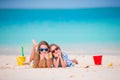 Adorable little girls during summer vacation. Kids with beach toys on the white beach Royalty Free Stock Photo