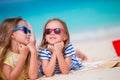 Adorable little girls during summer vacation. Kids on the white beach Royalty Free Stock Photo