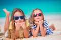 Adorable little girls during summer vacation. Kids on the white beach Royalty Free Stock Photo