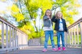 Adorable little girls at warm autumn day outdoors Royalty Free Stock Photo