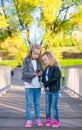 Adorable little girls at warm autumn day outdoors Royalty Free Stock Photo