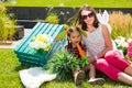 Adorable little kazakh, asian child girl with mother with carrot on summer green nature background.