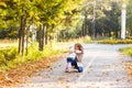 Adorable little kid girl and young woman in beautiful autumn forest. Daughter running to mother. Family portrait, fall Royalty Free Stock Photo