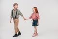 adorable little kids holding hands and walking together Royalty Free Stock Photo