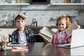 adorable little kids with lot of books looking at camera Royalty Free Stock Photo