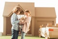 adorable little kids petting little labrador puppy Royalty Free Stock Photo