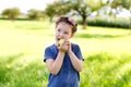 Adorable little preschool kid girl eating green apple on organic farm Royalty Free Stock Photo