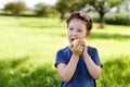 Adorable little preschool kid girl eating green apple on organic farm Royalty Free Stock Photo