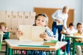 adorable little schoolgirl reading book Royalty Free Stock Photo