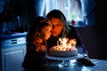 Adorable little toddler girl celebrating third birthday. Baby child daughter and young mother blowing candles on cake Royalty Free Stock Photo