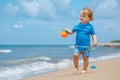 Adorable little toddler girl playing on sand beach Royalty Free Stock Photo