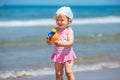 Adorable little toddler girl playing on sand beach Royalty Free Stock Photo