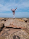 Adorable little traveler girl raising hands Child climbing on mountain summit spending time on nature walking having fun Royalty Free Stock Photo