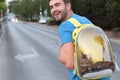 Adorable man carrying his cat in bubble style backpack Royalty Free Stock Photo