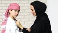 Adorable middle eastern woman playing with her son at home Royalty Free Stock Photo