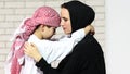 Adorable middle eastern woman playing with her son at home Royalty Free Stock Photo