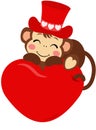 Adorable monkey on top of the big red heart