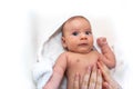 Adorable 2 months old little baby boy on towel after bath in his mother`s hands Royalty Free Stock Photo