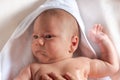 Adorable 2 months old little baby boy on towel after bath in his mother`s hands Royalty Free Stock Photo