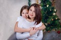 Adorable mother and daughter hugging at Christmas Royalty Free Stock Photo