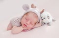 Newborn sleeping with kitten Royalty Free Stock Photo