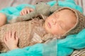 Adorable newborn baby with bunny-toy in cot Royalty Free Stock Photo