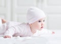 Adorable newborn baby girl in a pink knited hat