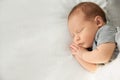 Adorable newborn baby peacefully sleeping on bed Royalty Free Stock Photo