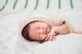 Adorable newborn baby peacefully sleeping on a white blanket. Royalty Free Stock Photo