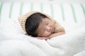 Adorable newborn baby peacefully sleeping on a white blanket. Royalty Free Stock Photo