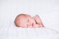 Adorable newborn baby sleeping under knitted blanket Royalty Free Stock Photo