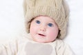 Adorable newborn baby wearing big knitted hat Royalty Free Stock Photo