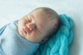 Adorable newborn child sleeping on a bed Royalty Free Stock Photo