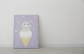 Adorable picture of penguin and ice cream on floor near wall, space for text. Children`s room interior element