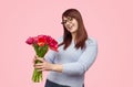 Happy woman with bouquet of tulips