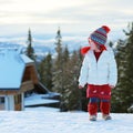 Adorable preschooler girl enjoys winter at ski resort Royalty Free Stock Photo