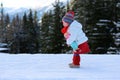 Adorable preschooler girl enjoys winter at ski resort Royalty Free Stock Photo