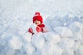 Adorable preschooler girl having fun in beautiful winter park on a snowy cold winter day Royalty Free Stock Photo