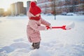 Adorable preschooler girl having fun in beautiful winter park on a snowy cold winter day Royalty Free Stock Photo