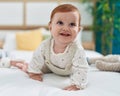 Adorable redhead toddler smiling confident crawling on bed at bedroom Royalty Free Stock Photo