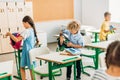 adorable schoolchildren preparing for lesson