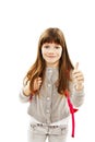 Adorable schoolgirl showing OK sign