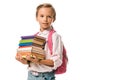 adorable schoolkid holding colorful books isolated on white.