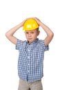 Adorable serious future builder in yellow helmet and blue checkred shirt, isolated on white background Royalty Free Stock Photo