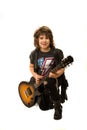 Adorable kid boy rocker with guitar