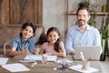 Adorable single-parent family sitting at the table